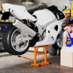 Cavalletto Alzamoto max 150 kg in Metallo con Superficie in Gomma e Manovella, 48x34x43 cm, Arancione - immagine 2